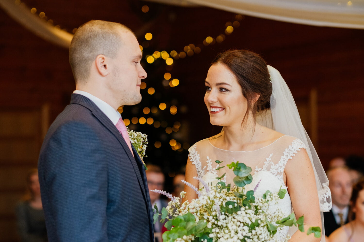 bride smiling at groom