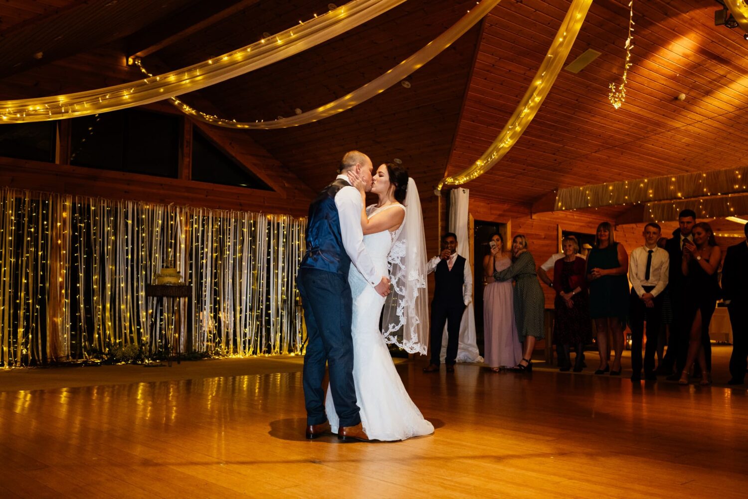 couple kiss with fairy lights