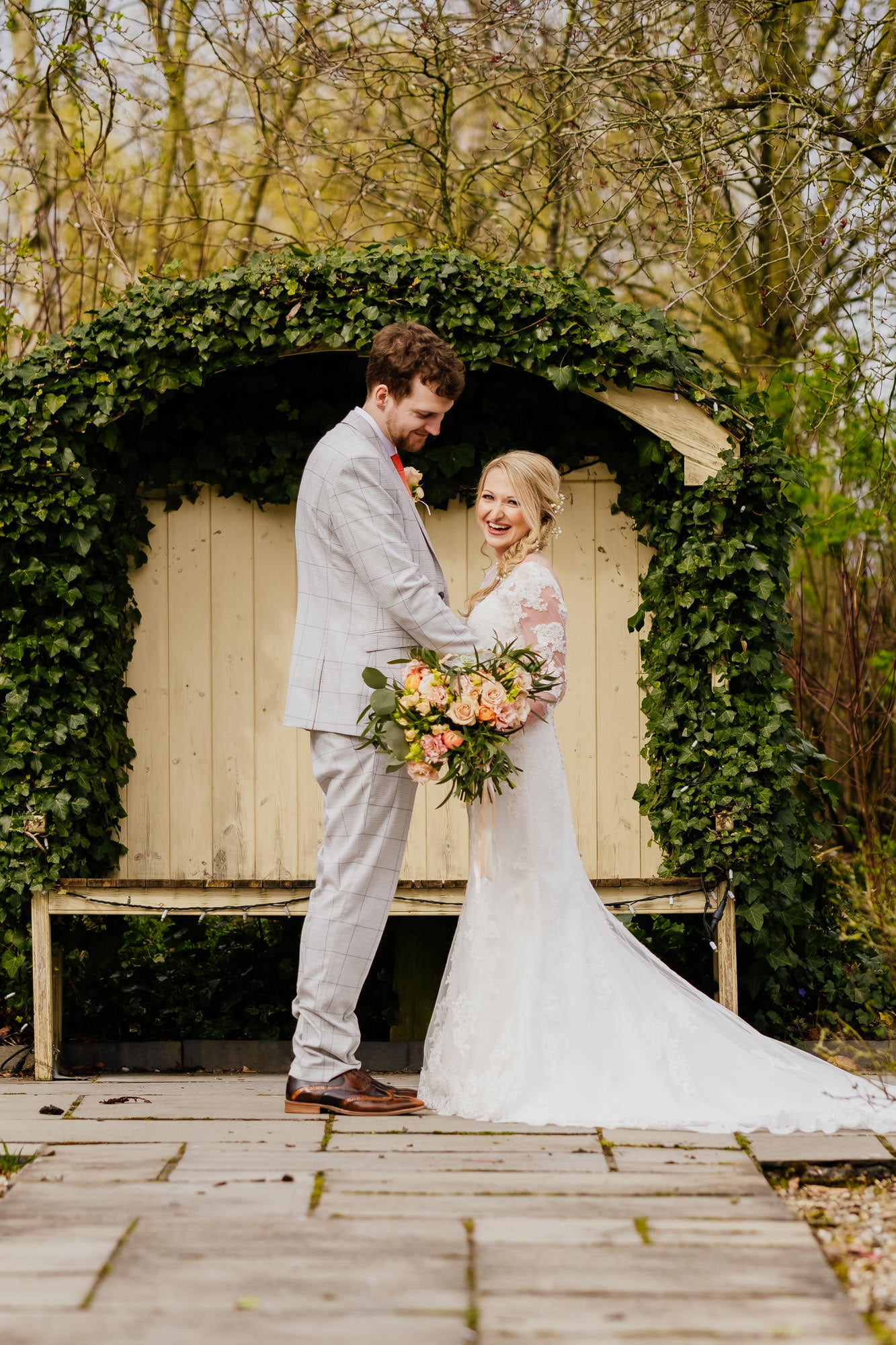 bride laughing during couple portrait
