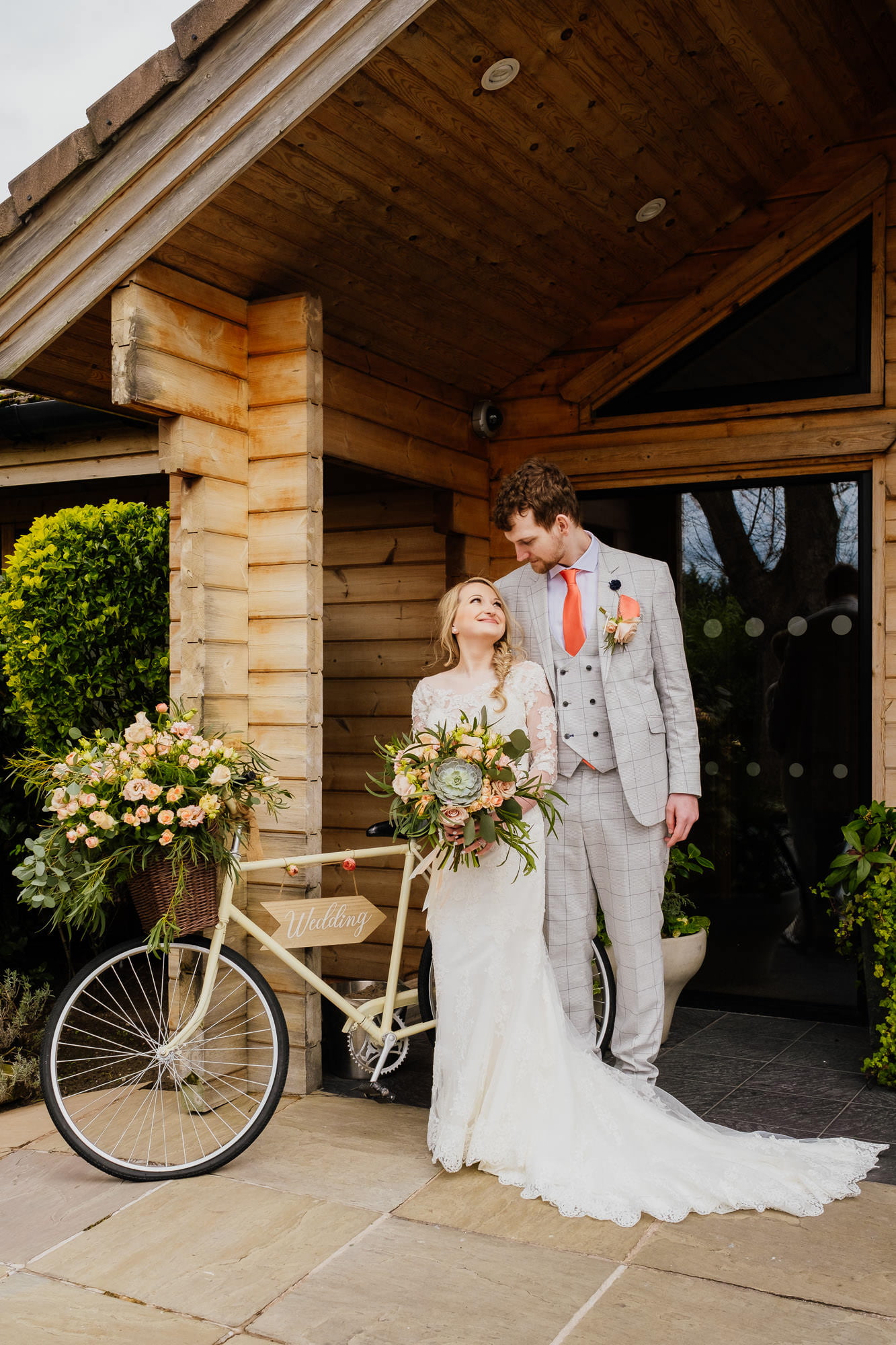 couple outside styal lodge on their wedding
