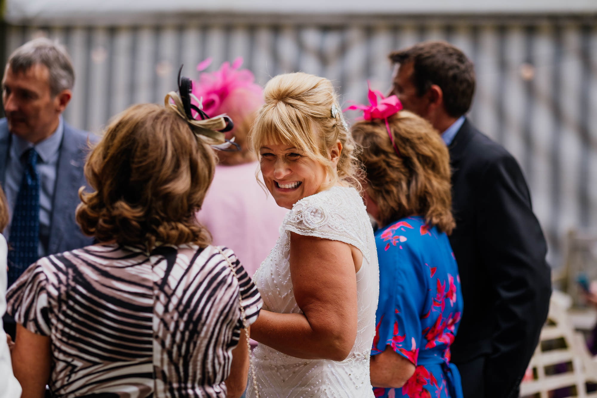Smiling bride interacting with guests