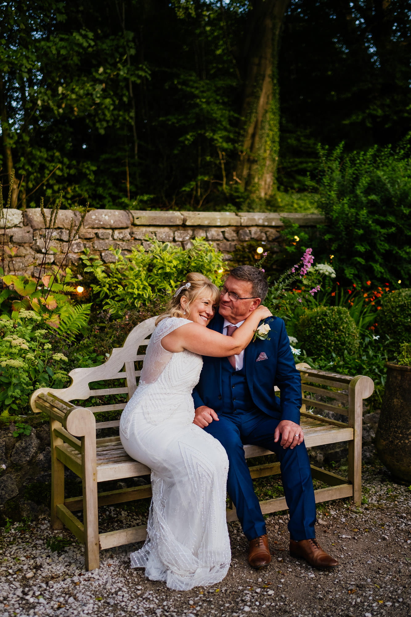 Couple hugging on a bench in beer garden