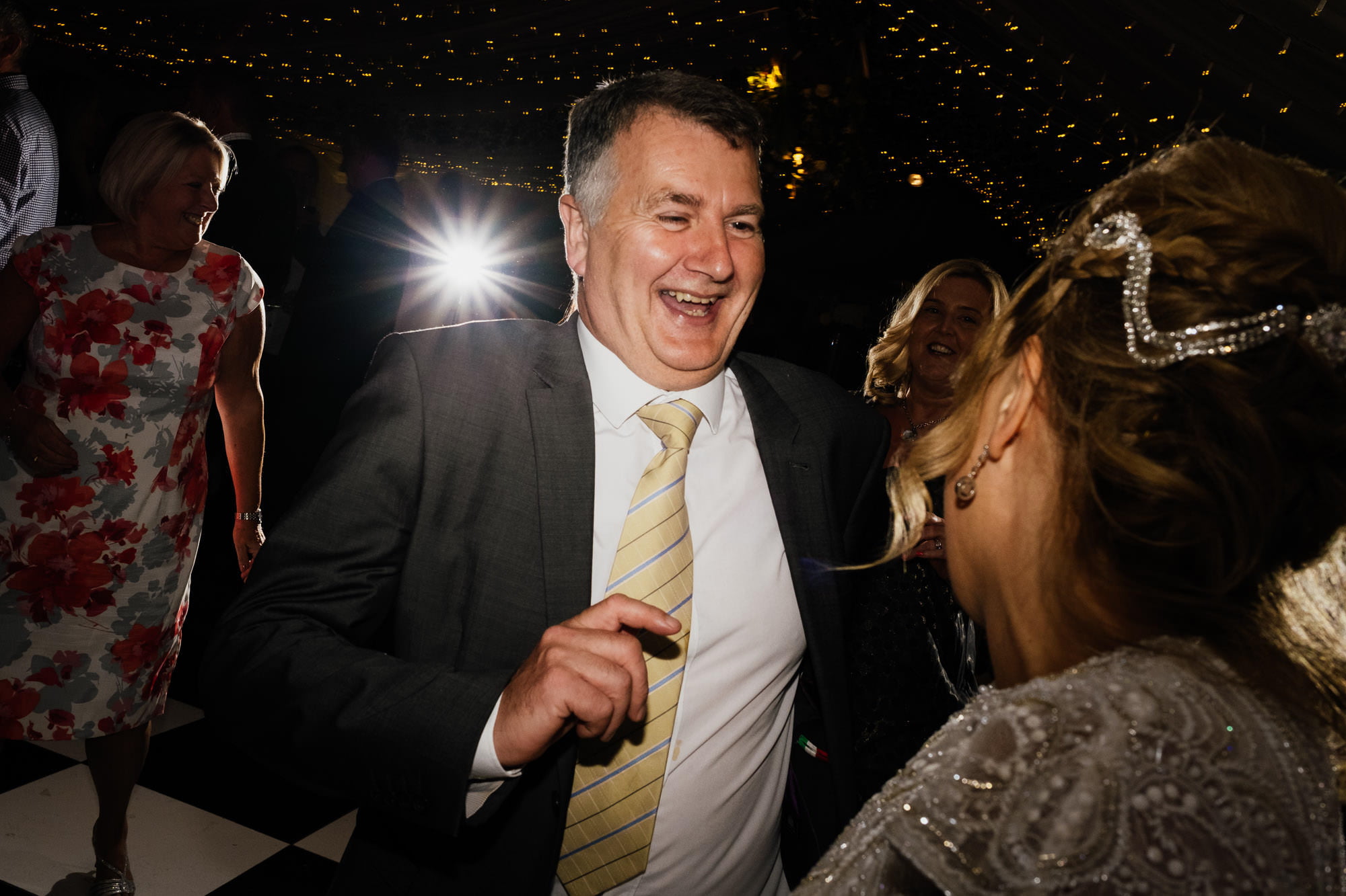 Man on the dancefloor at wedding reception
