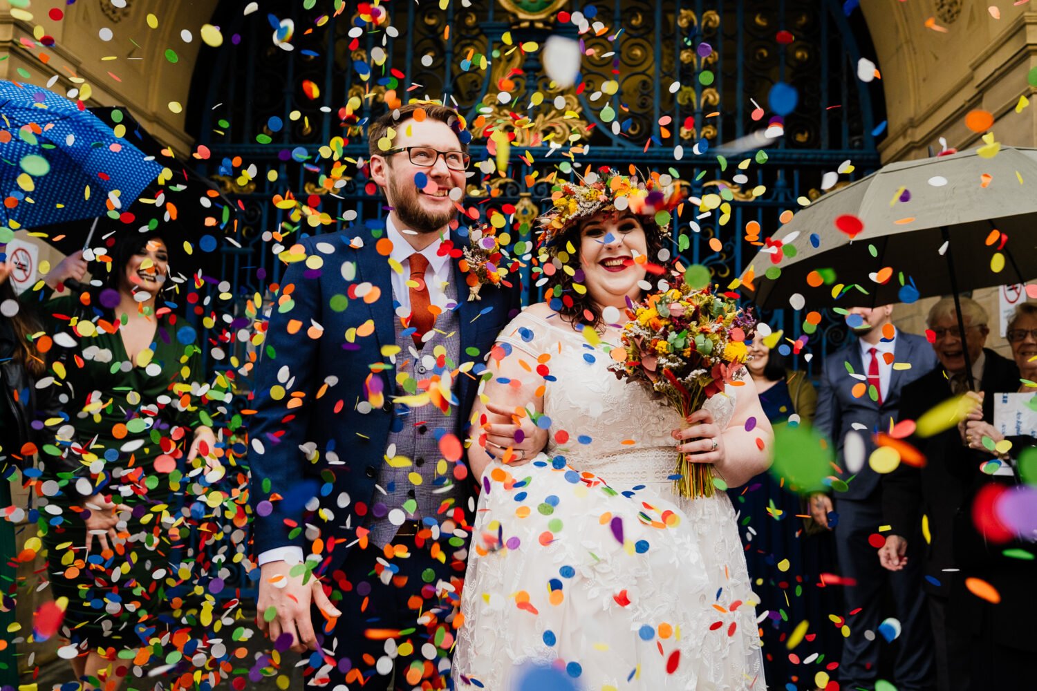 Bride and groom confetti throw with colourful paper