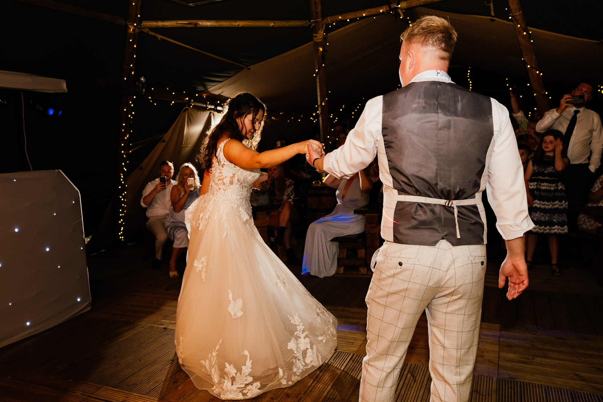 Bride twirls with groom during tipi first dance