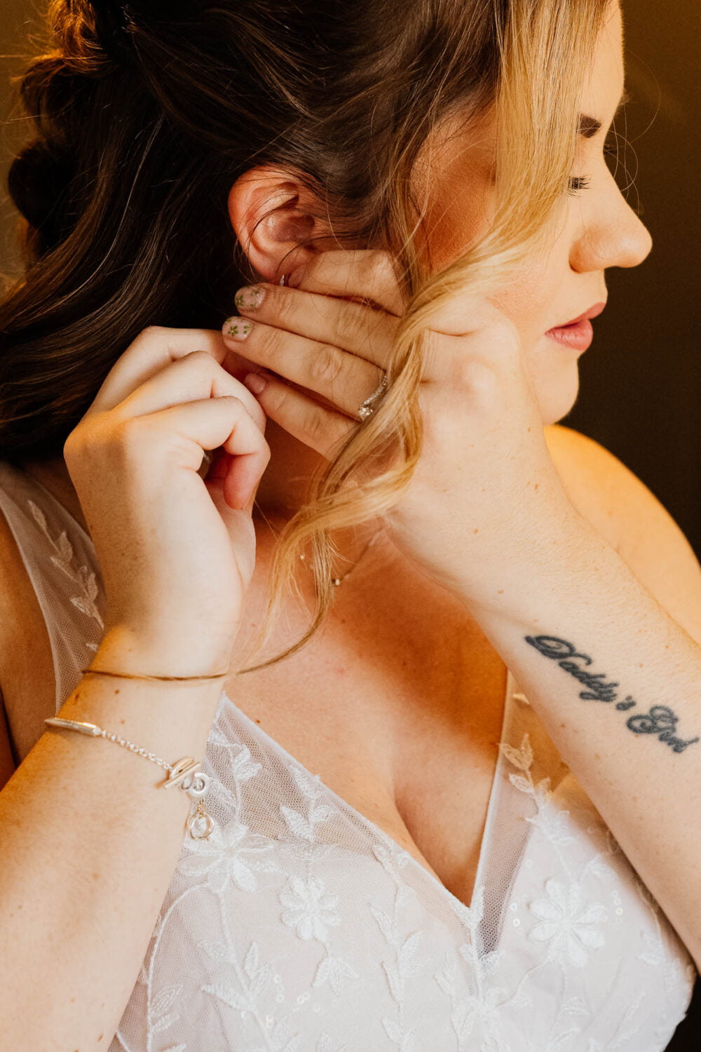 Bride putting in her earrings