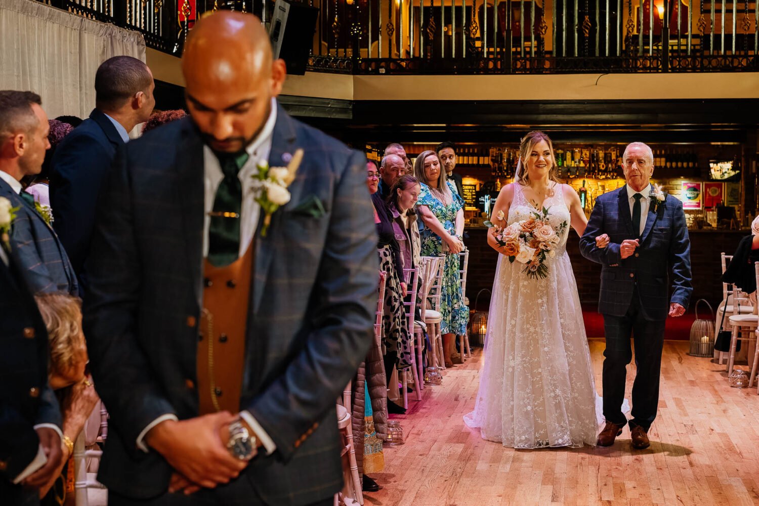 Bride and father arriving at The Engine Shed for wedding ceremony with groom waiting