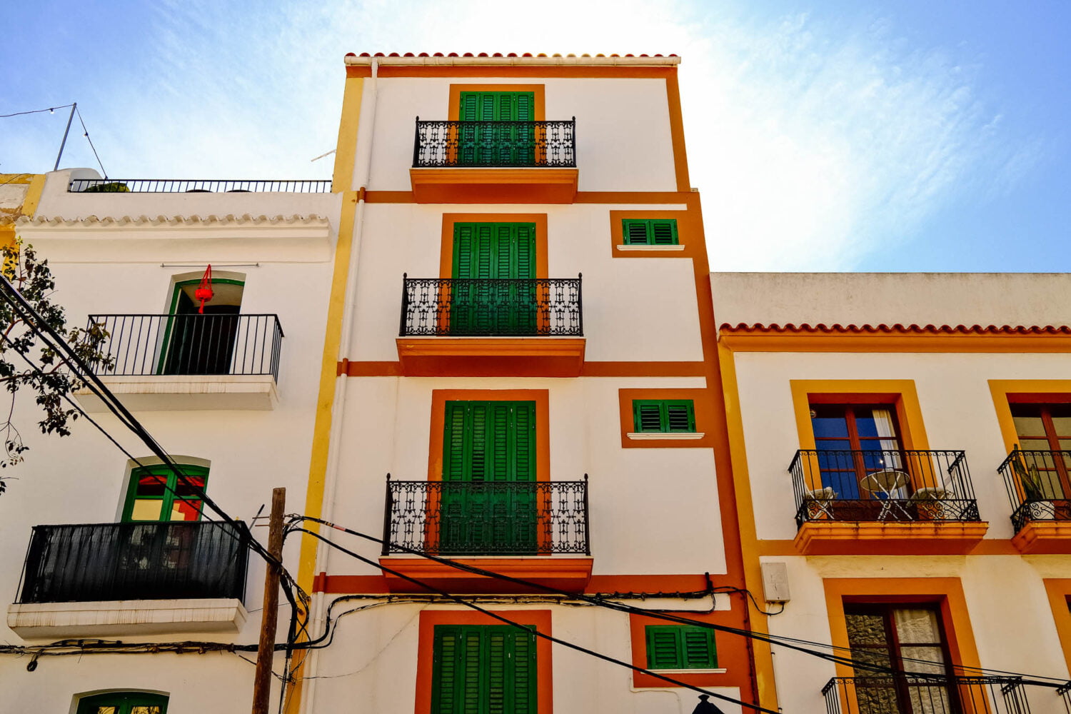 Colourful buildings with green shutters in Ibiza old town