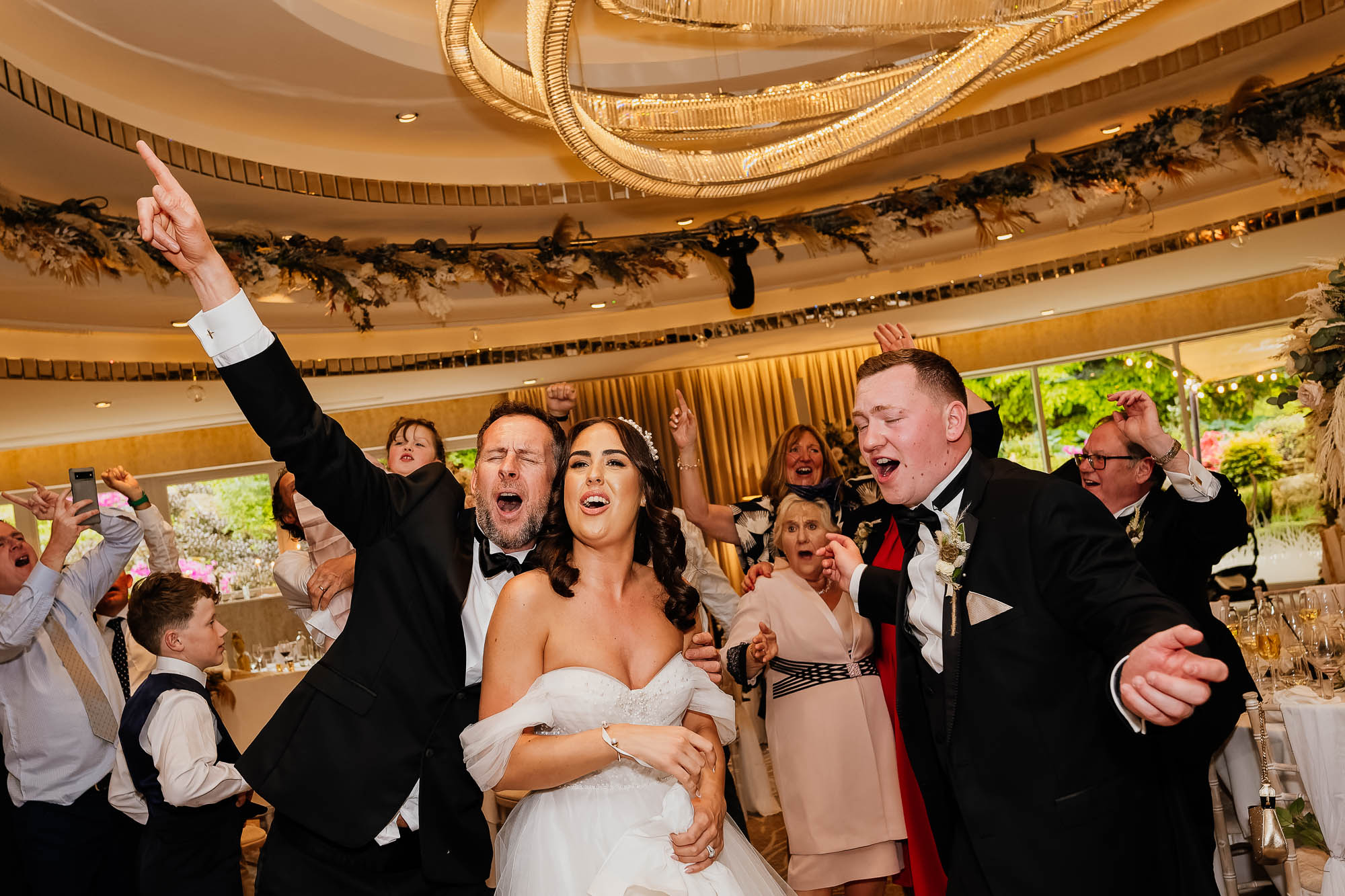 Everyone dancing at Grantley Hall wedding reception