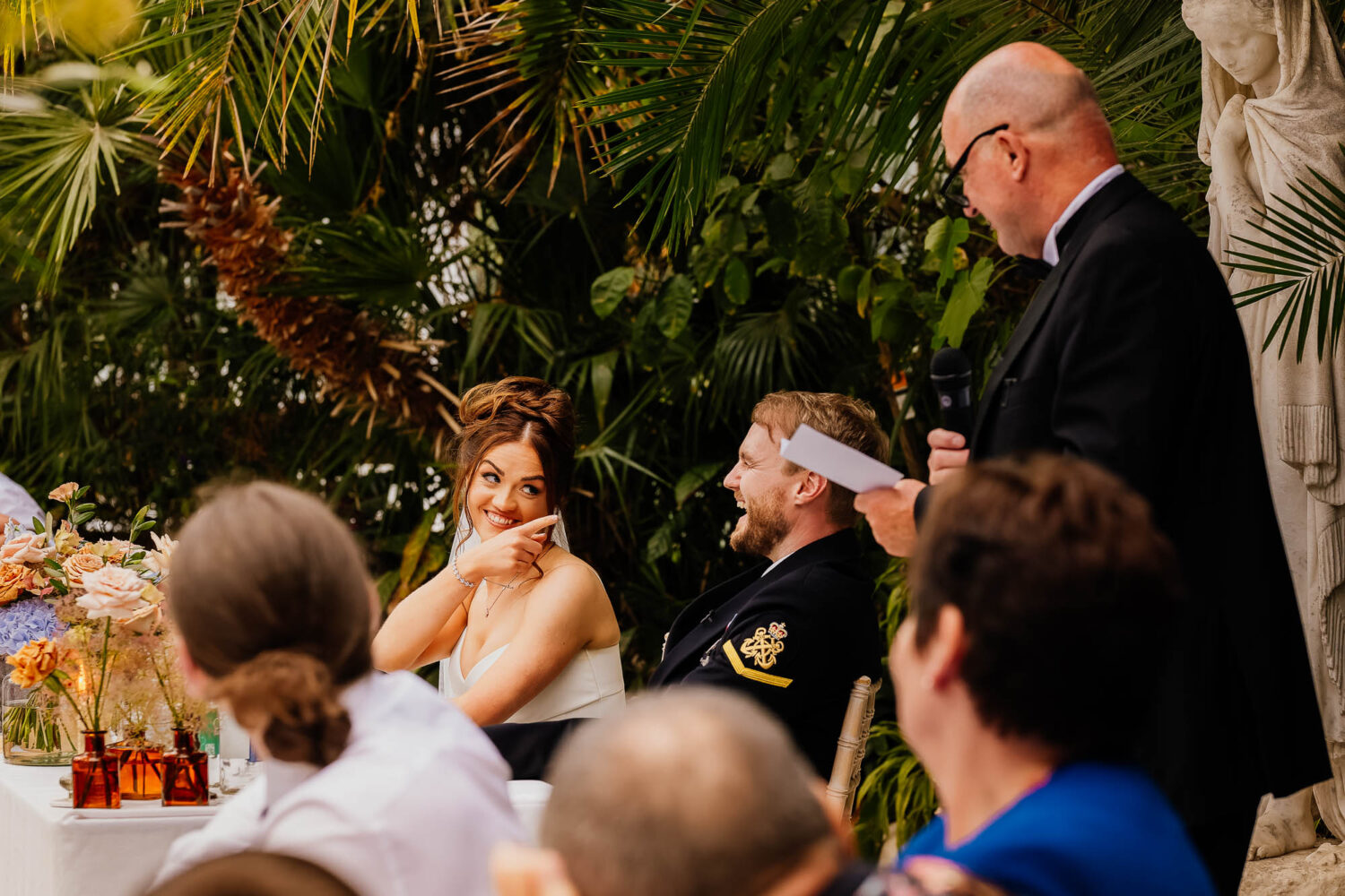 Bride pointing finger at groom during wedding speeches
