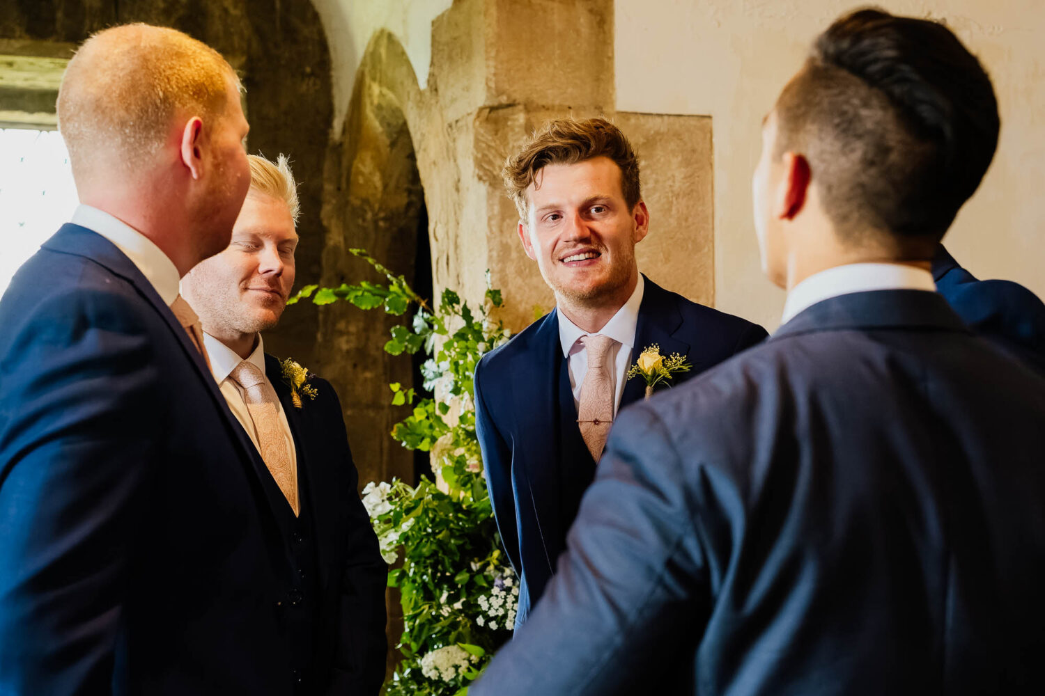 Groom waiting for the ceremony with groomsmen