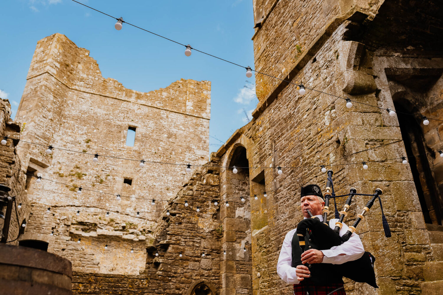 Bagpiper in the chapel at Bolton Castle