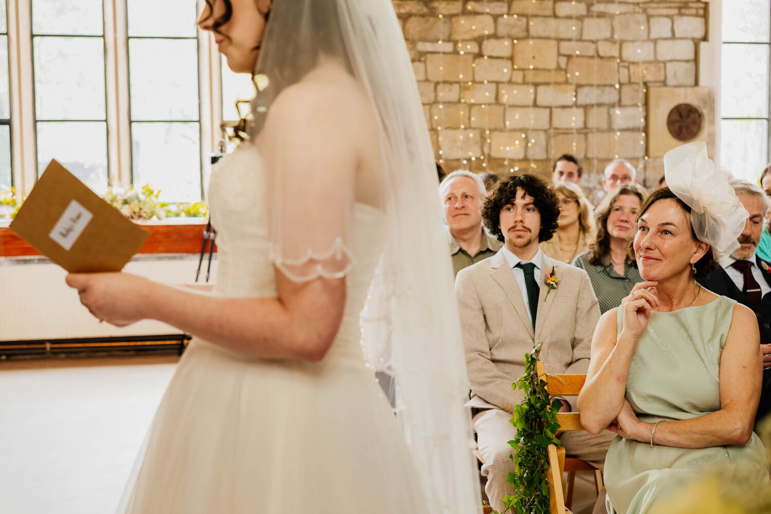 Mother of the bride watching her daughter say her vows