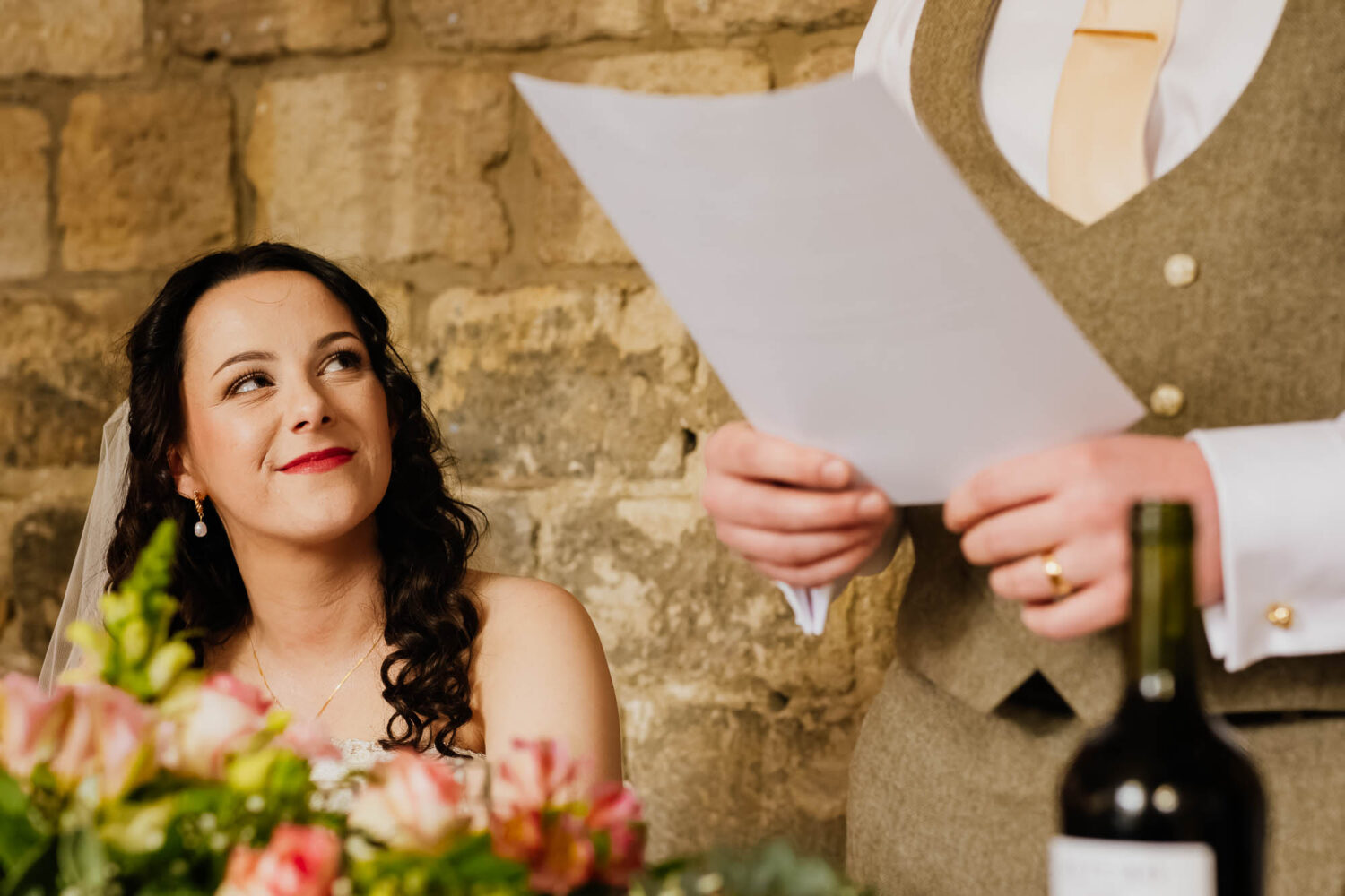 Bride looking at groom during speech