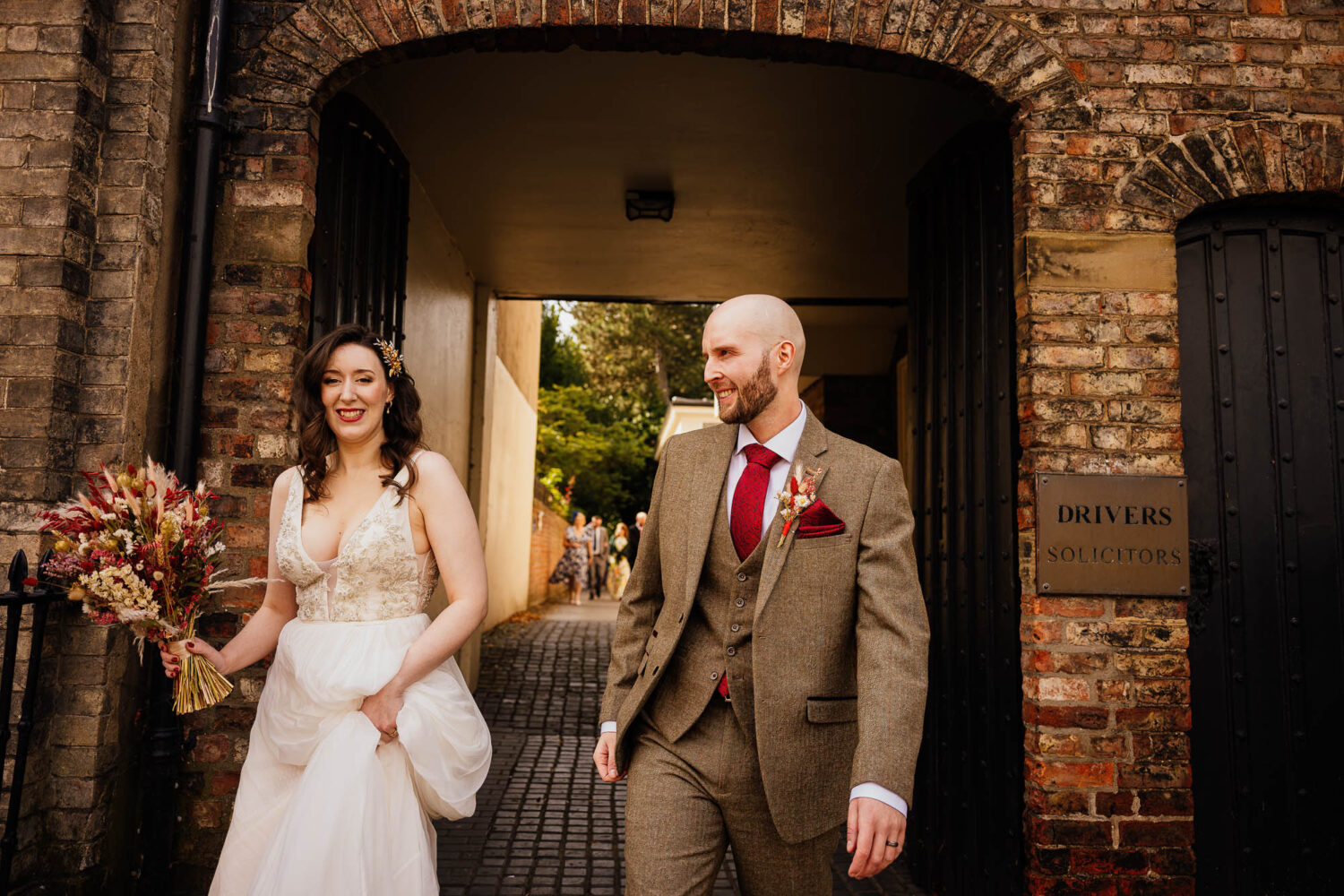Bride and groom leaving registry office ceremony