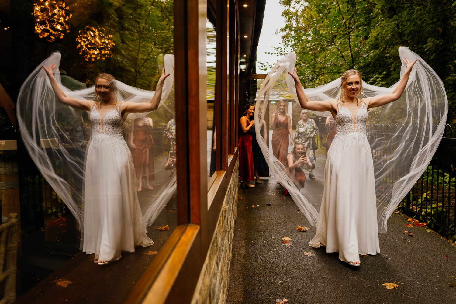 Bride throwing veil in the air at The Woodman Inn