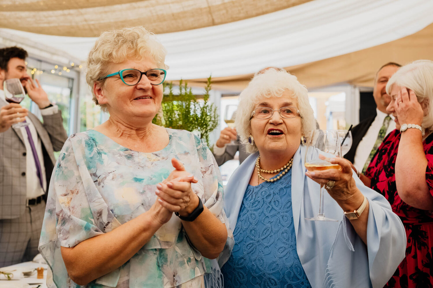 Relatives cheering wedding speeches
