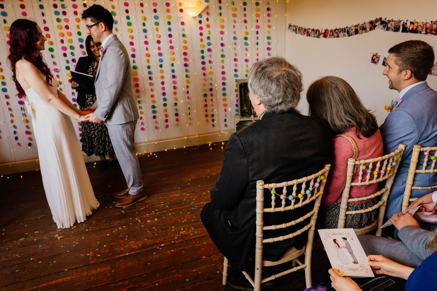 Couple during Chilli Barn ceremony with guest holding program