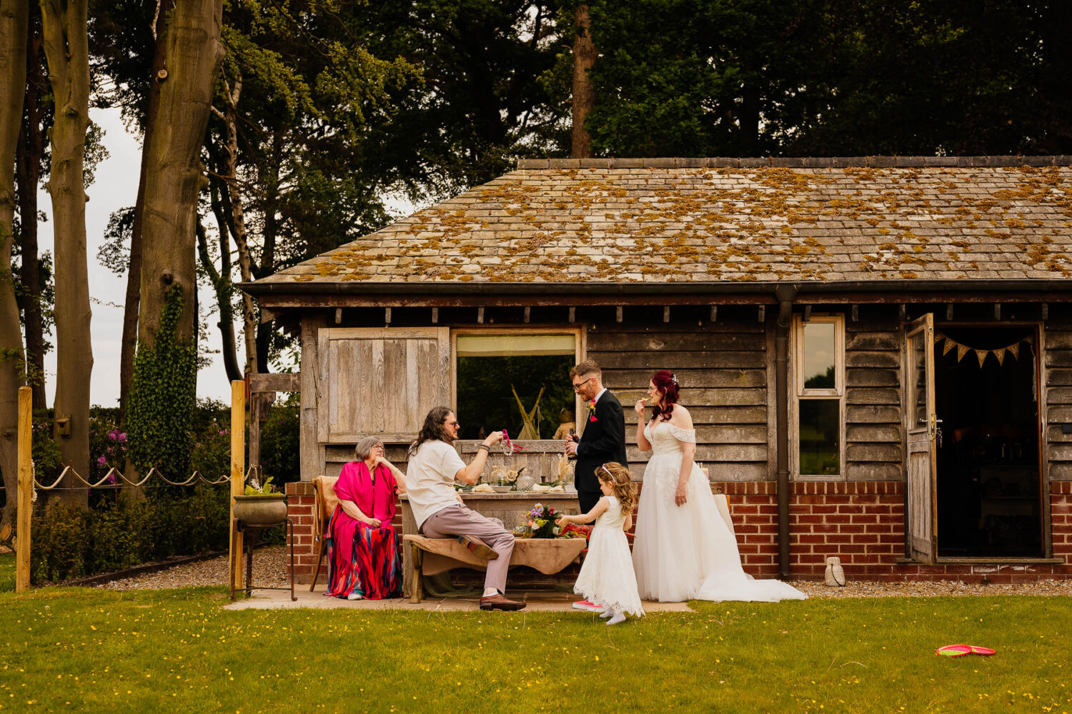 Wedding party outside The Stables at The Love Shack