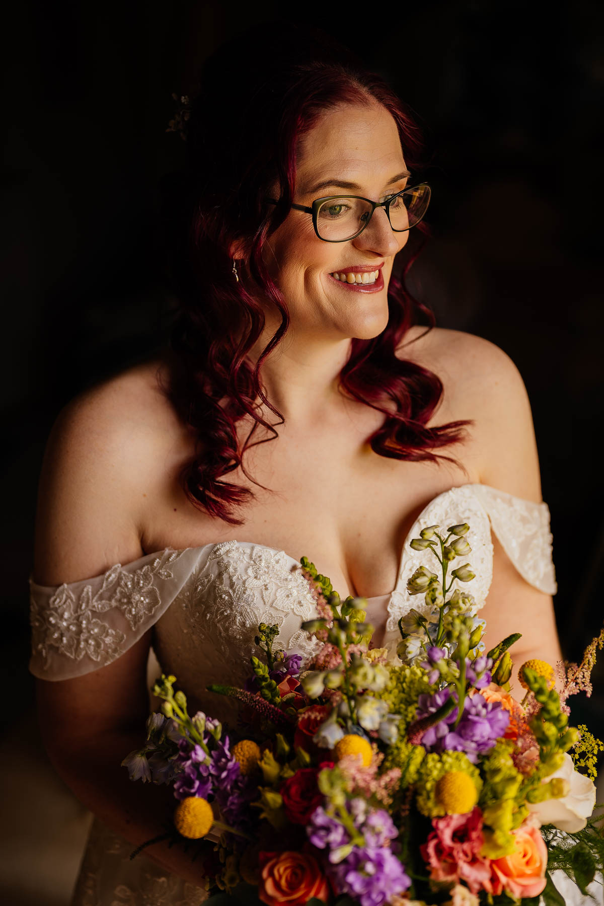 Natural light bridal portrait with colourful flowers