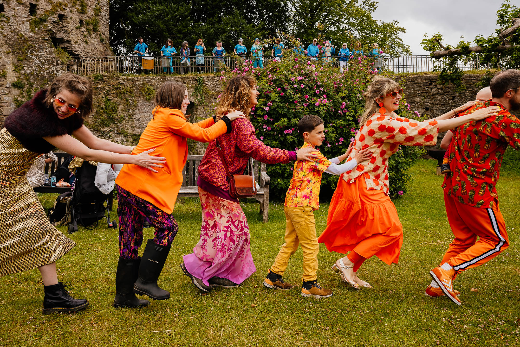 Guests doing conga with samba band in the background