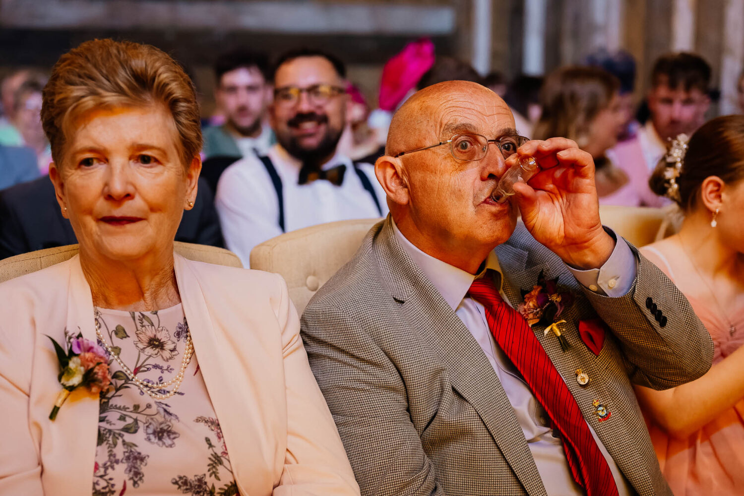 Grandad drinking a shot during wedding ceremony at Wharfedale Grange
