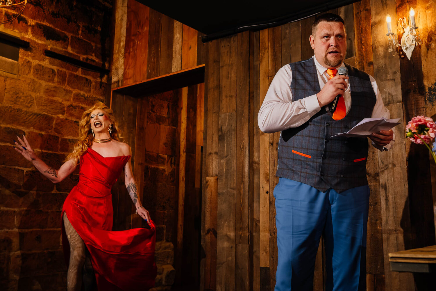 Best man speaking whilst drag queen enters as a surprise