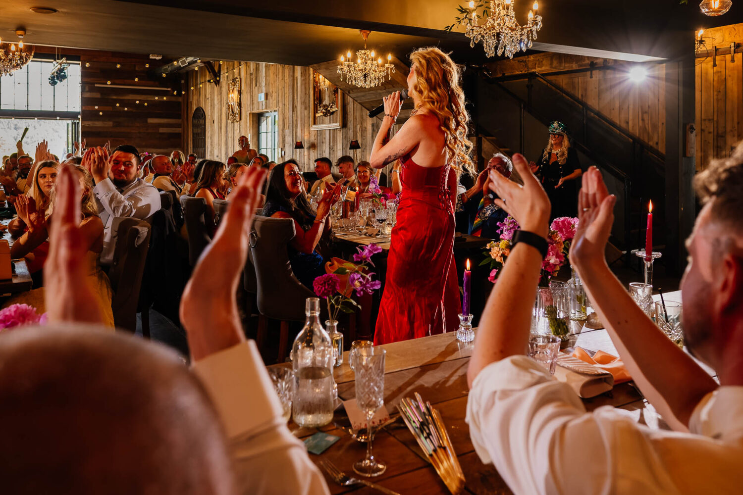 Grooms applauding drag queen performance