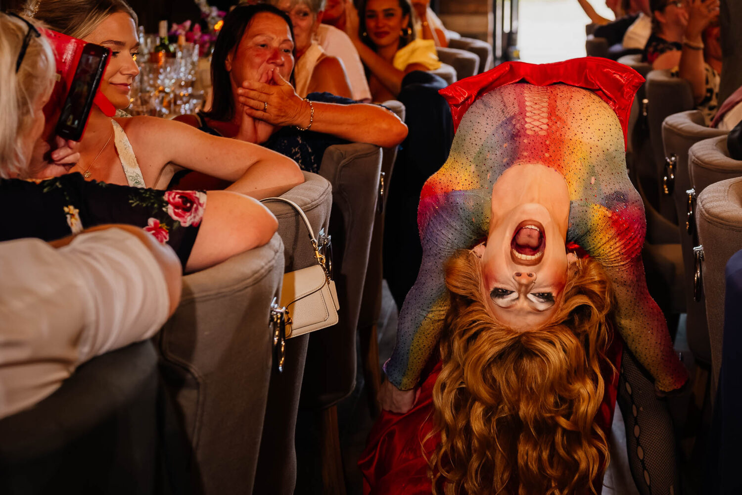 Drag queen upside down during performance for guests at Wharfedale Grange