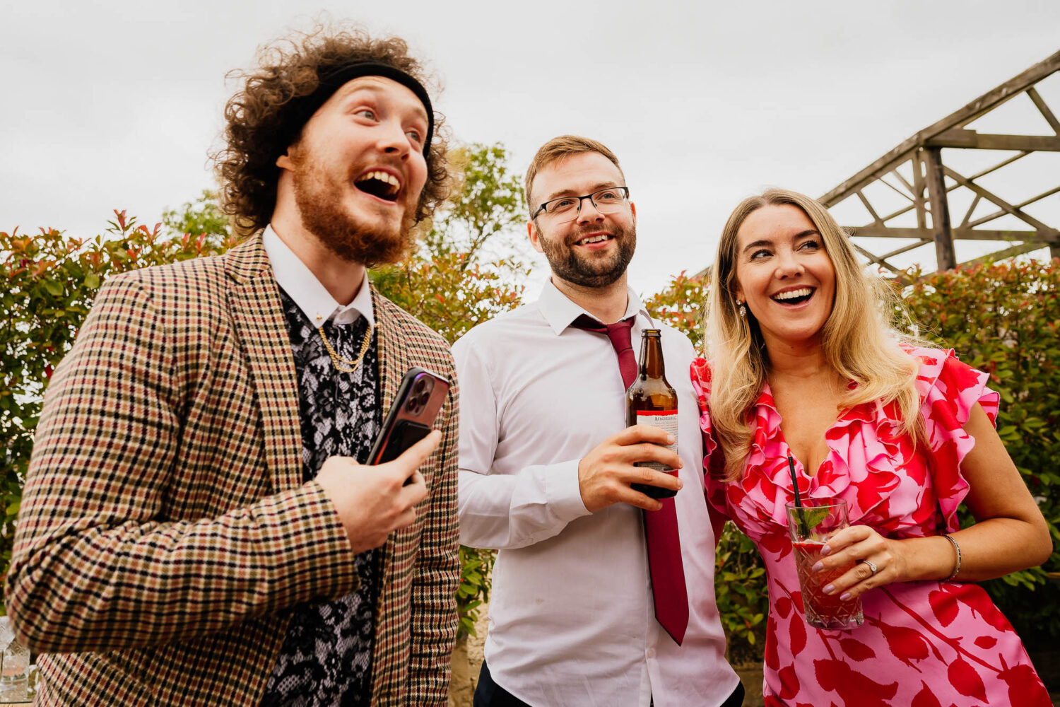 Guests smiling and laughing during wedding reception
