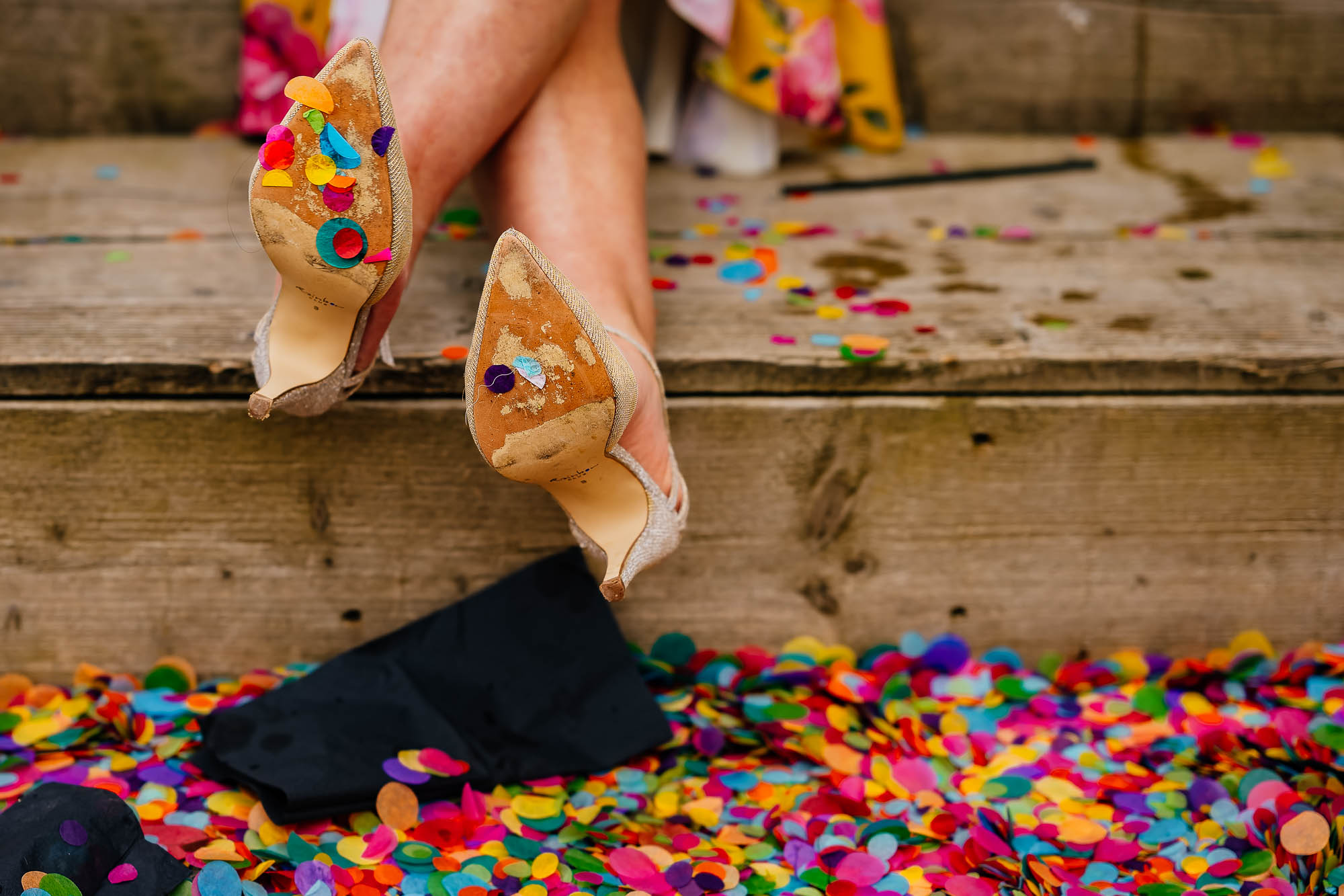 Confetti on the bottom of a guests wedding shoes