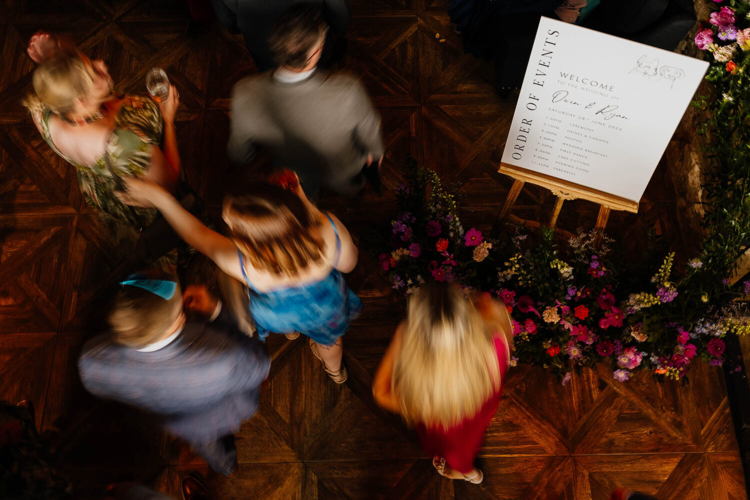 Slow motion guests walking past welcome sign at Wharfedale Grange