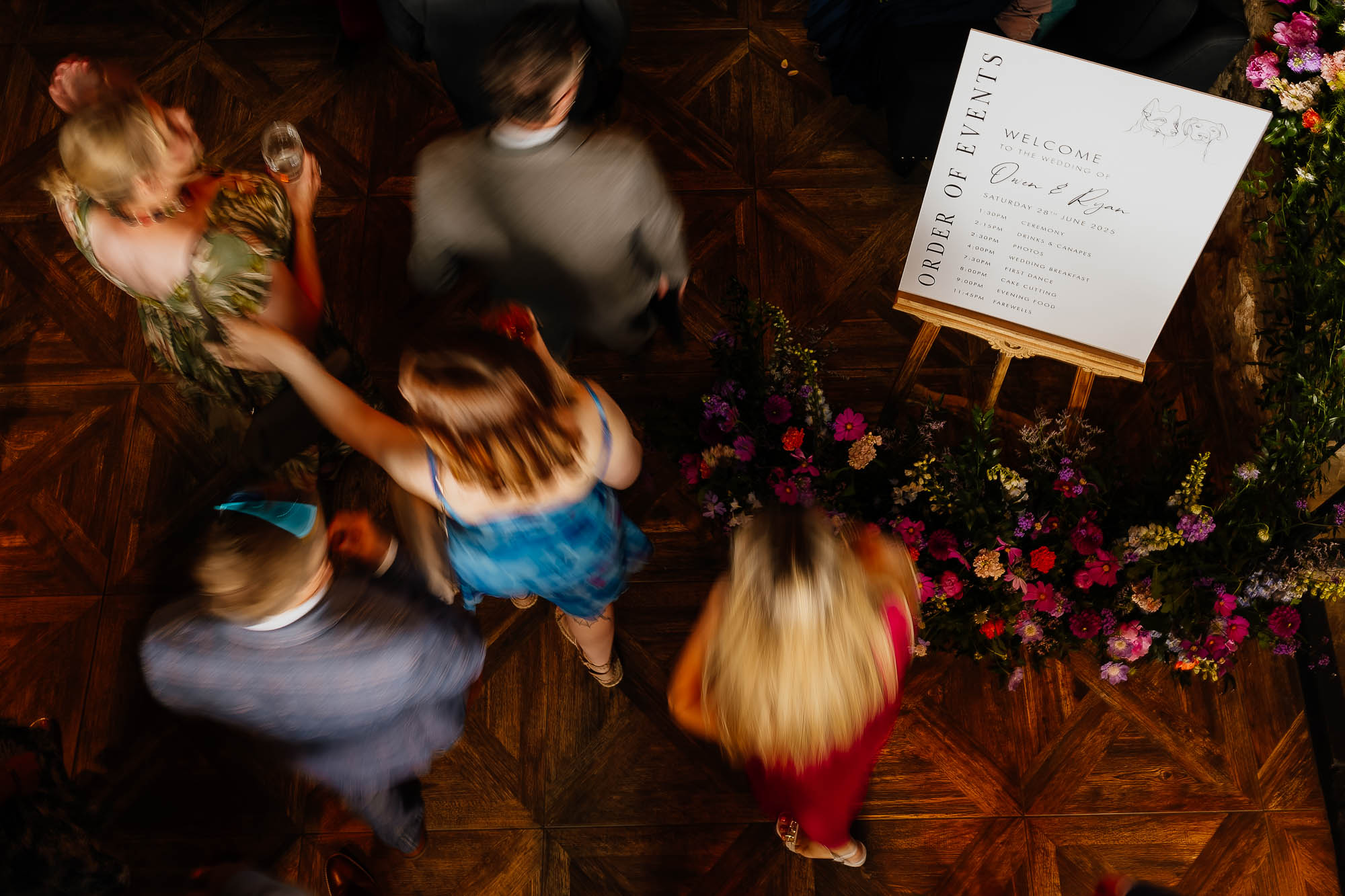 Slow motion guests walking past welcome sign at Wharfedale Grange