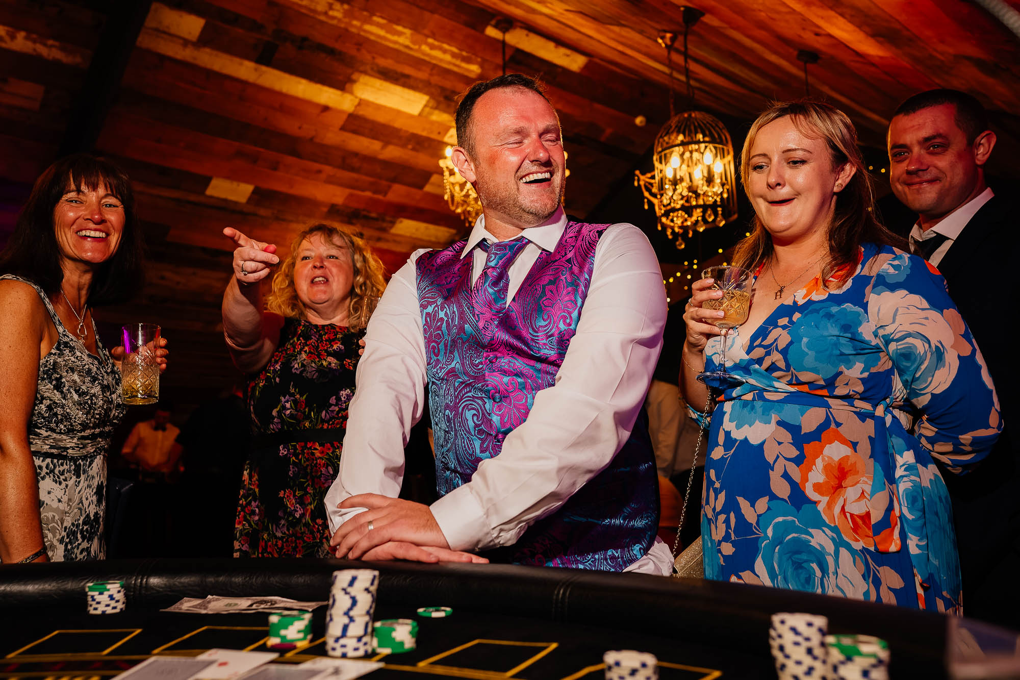 Wedding guest losing at the casino with guest reactions