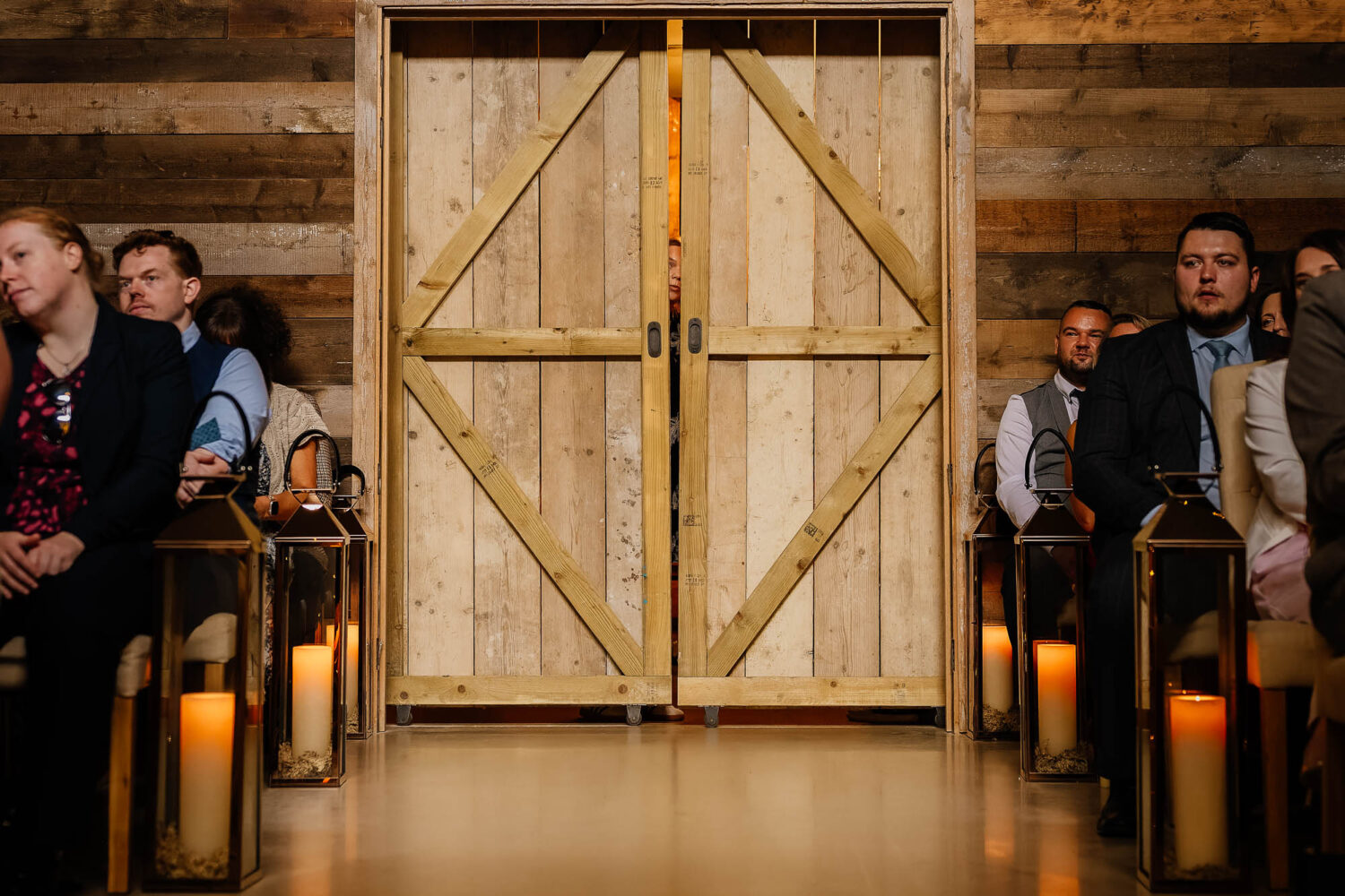Wedding coordinator peeking through doors at Wharfedale Grange