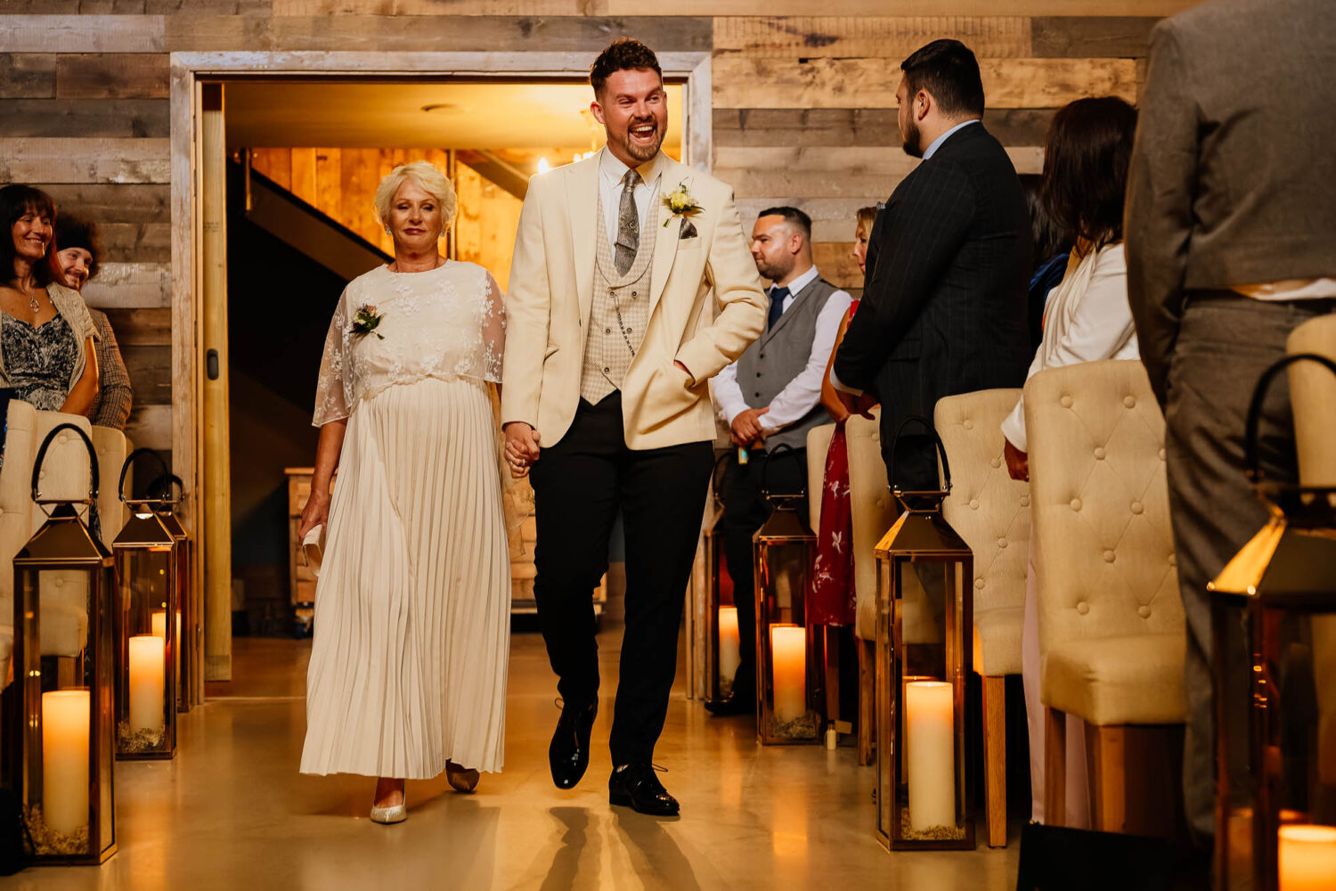 Groom and mum walking down the aisle