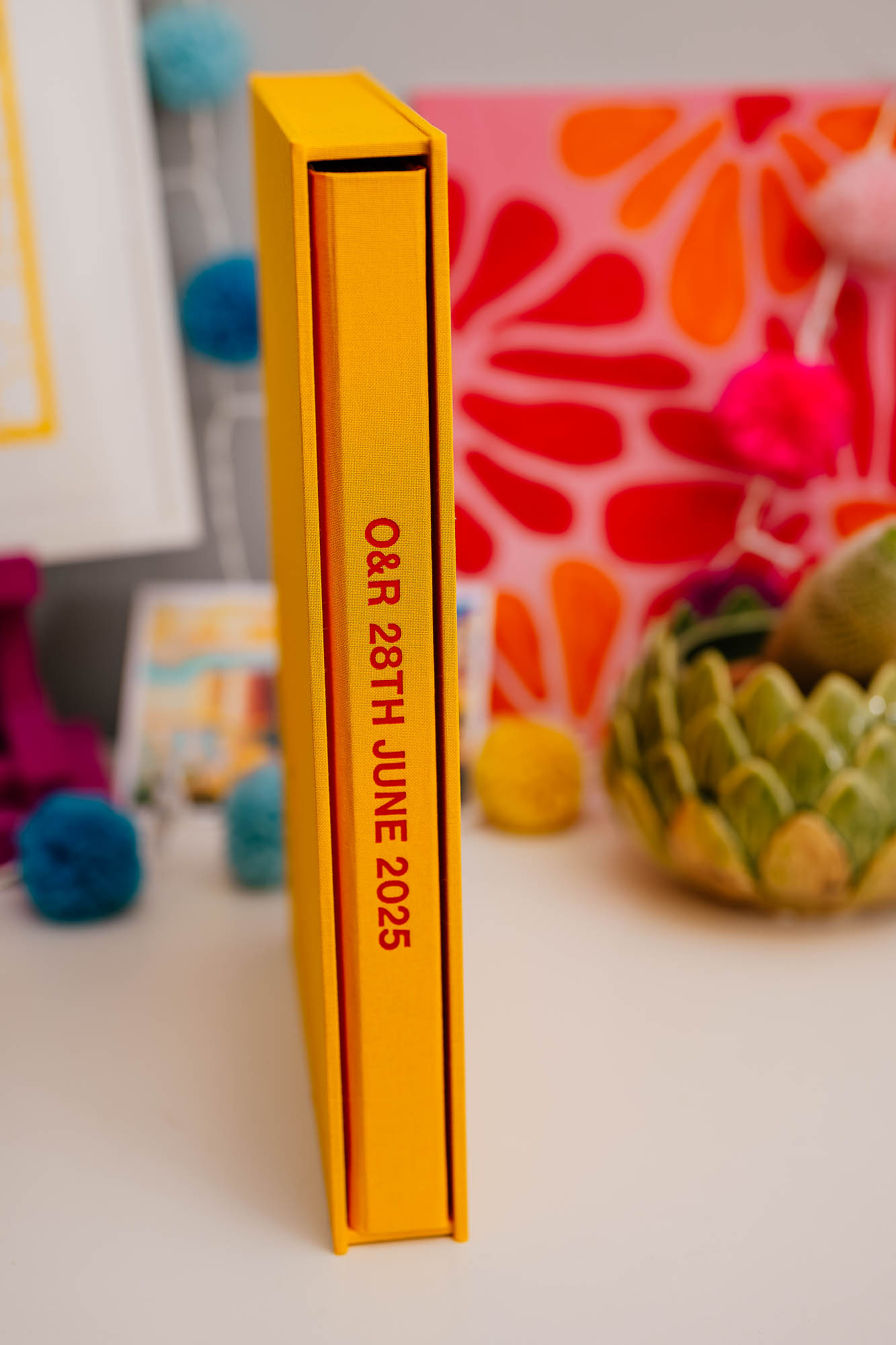 Spine of a coffee table book with writing