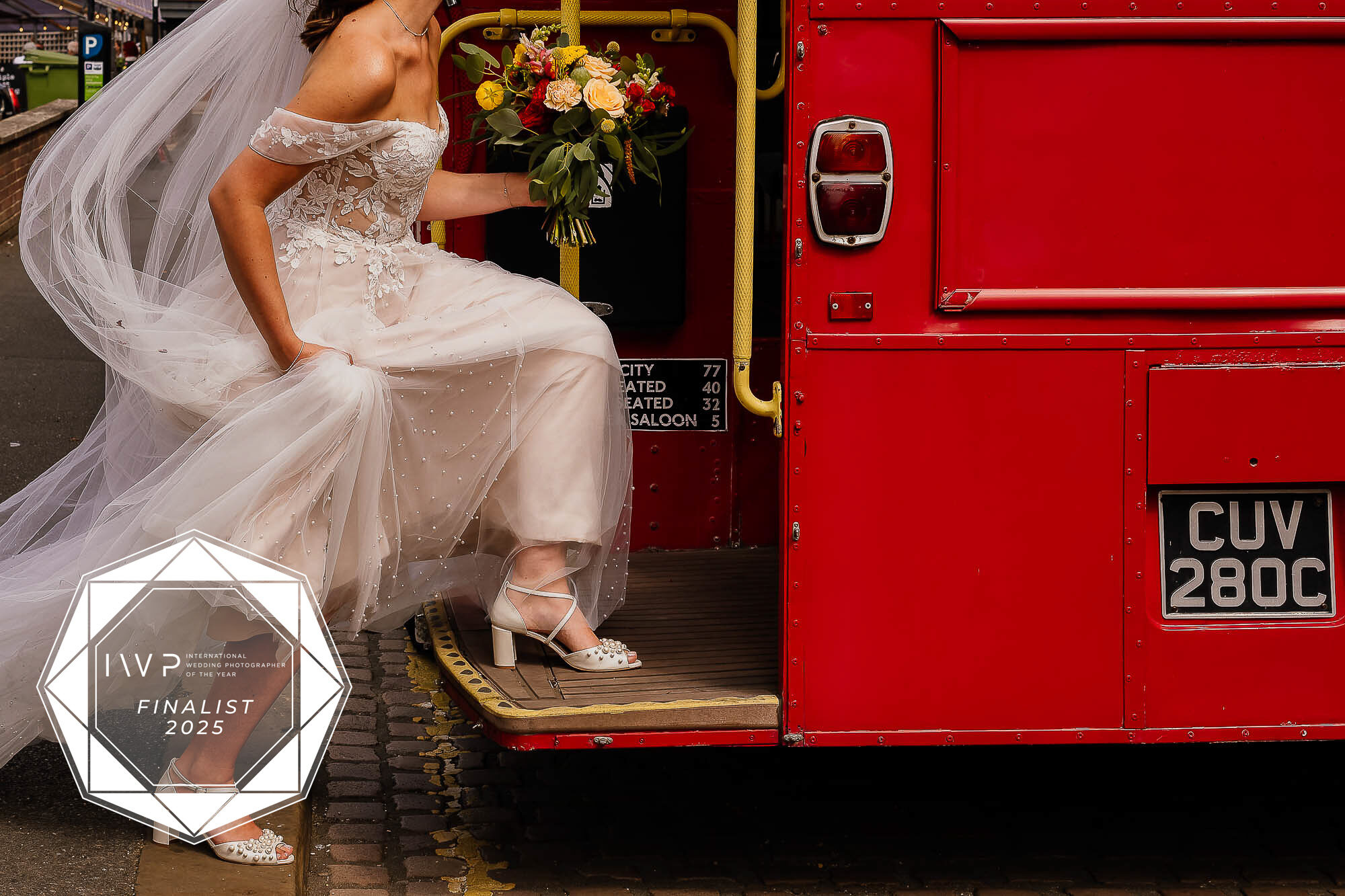 A finalist image in the IWPOTY awards of a bride stepping onto a red bus