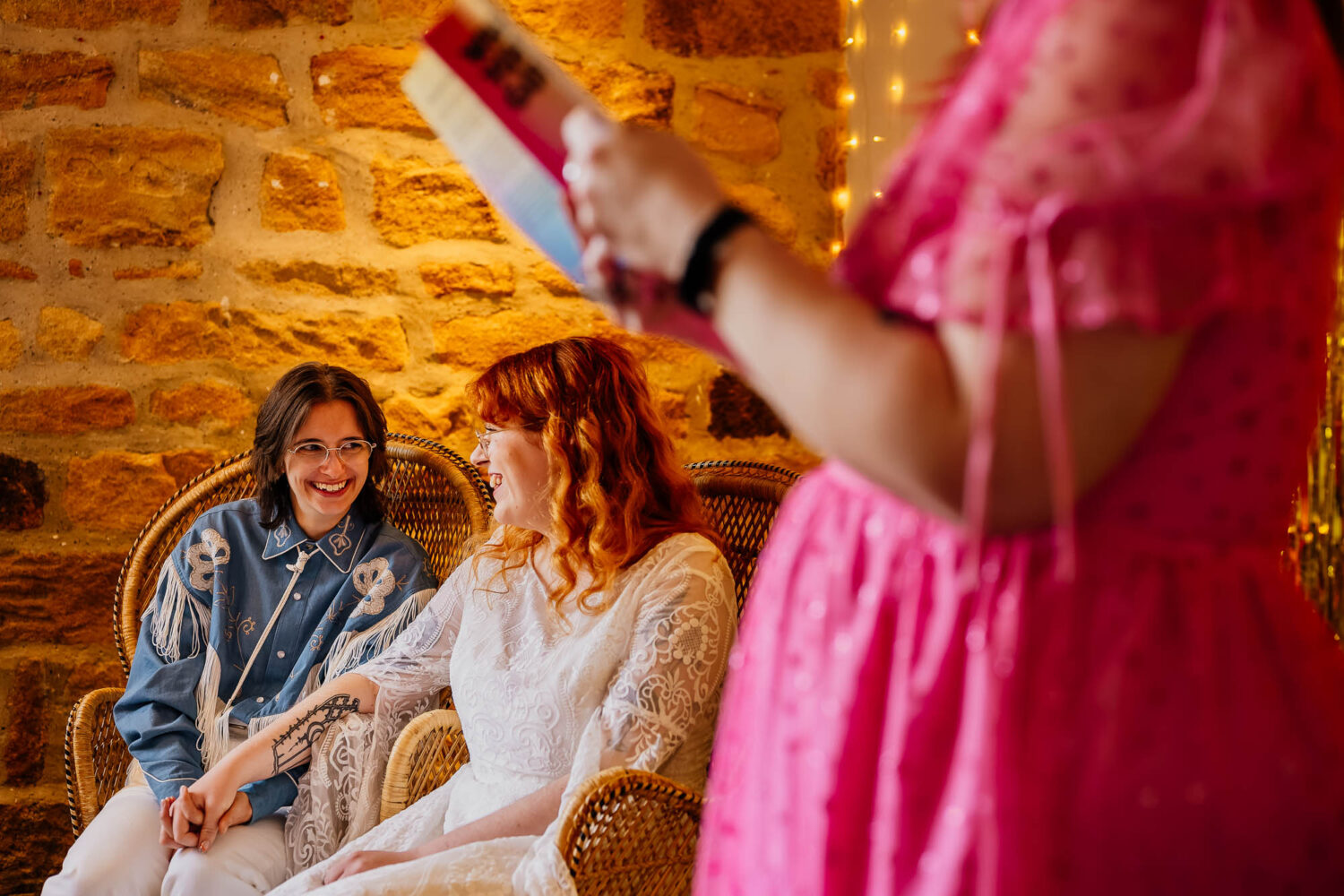 Couple looking at each other with celebrant in the foreground