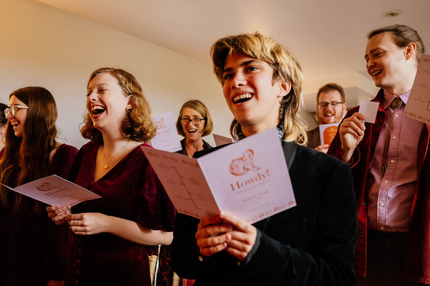 Guests singing from order of service
