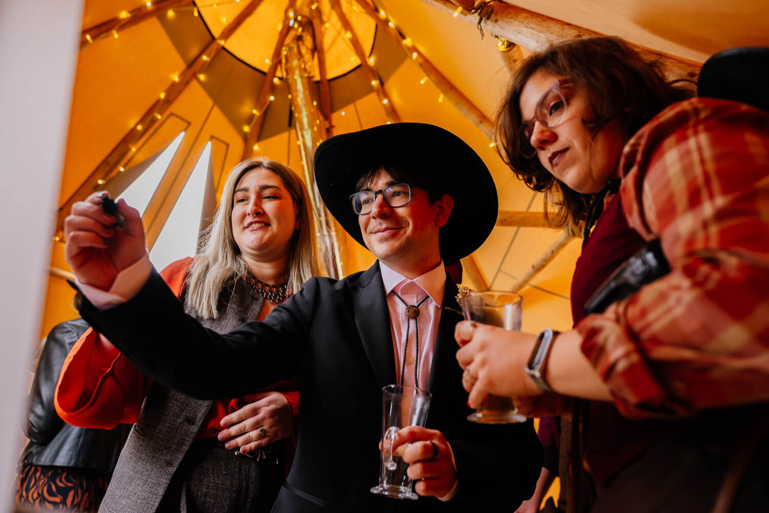 Guests solving a crossword in a tipi