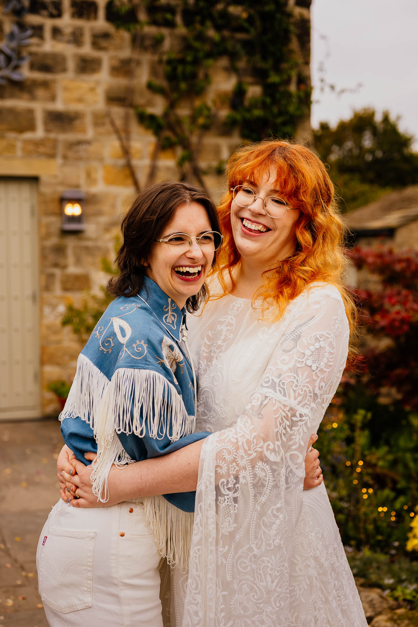 Couple with arms around each other smiling and laughing