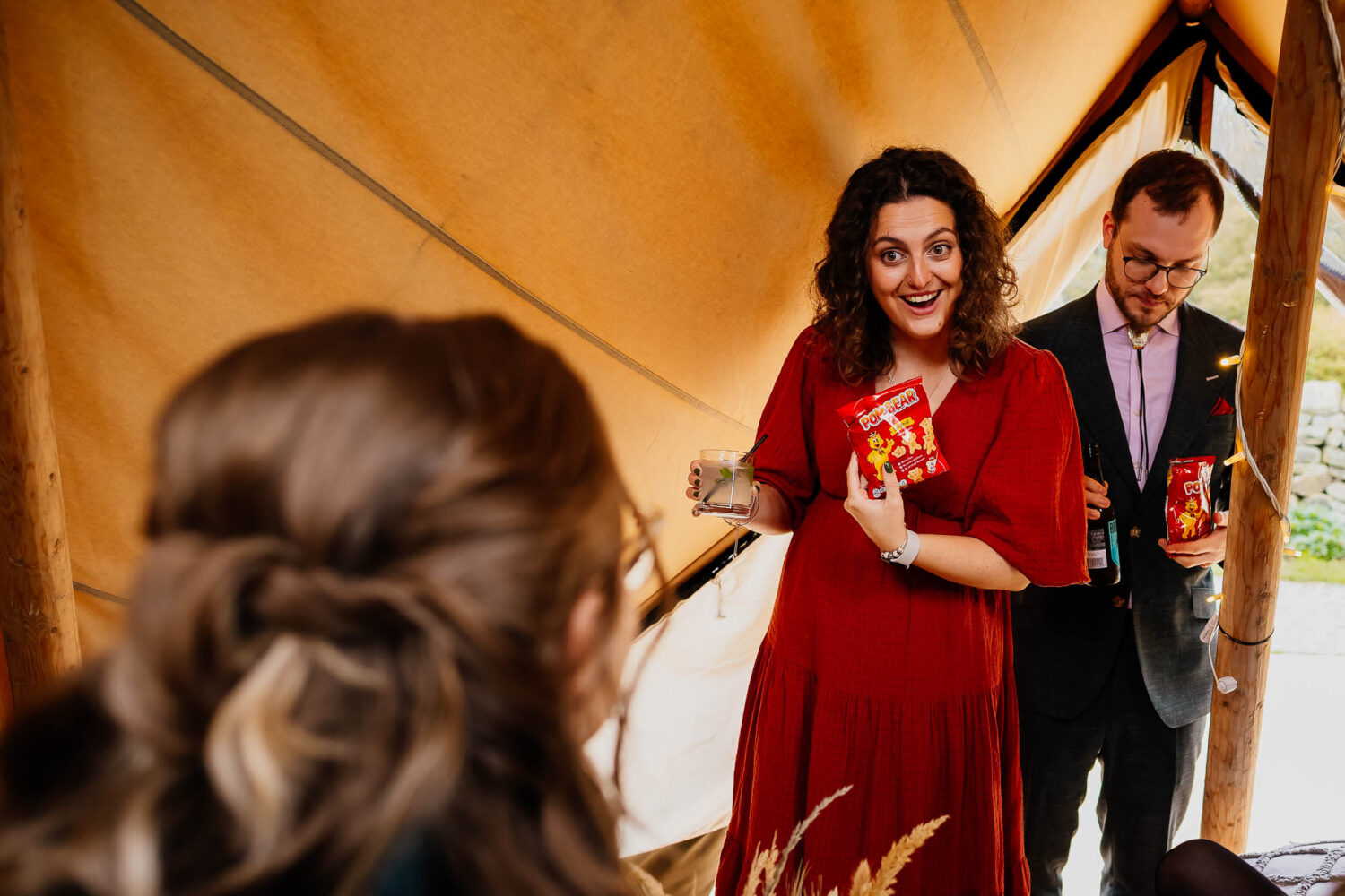 Guest holding pombears and looking excited