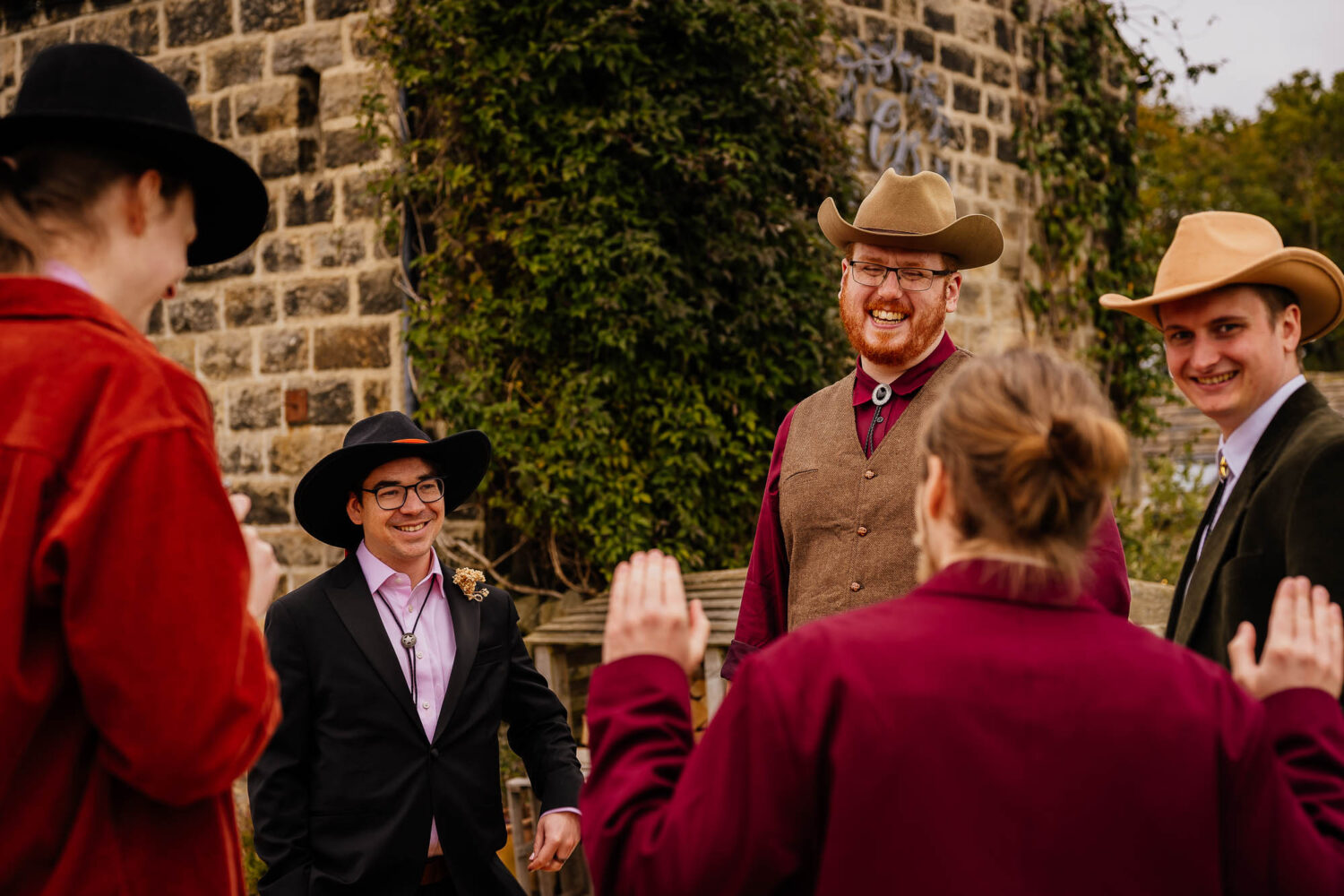 Wedding guests outside in cowboy hats