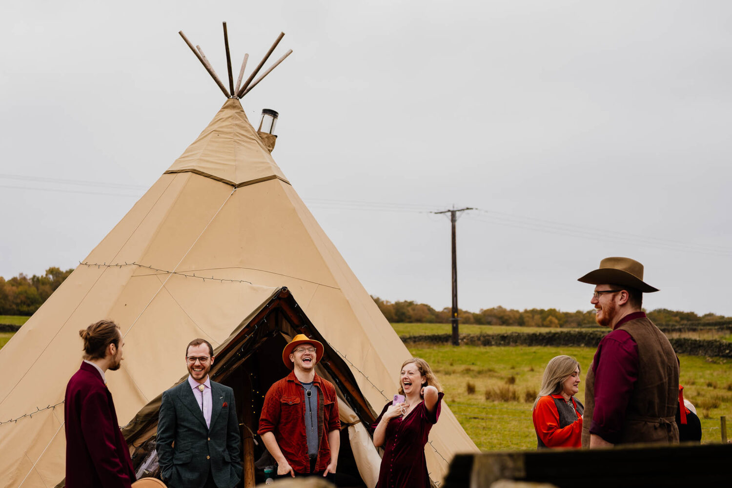 Guests waiting for ceremony outside tipi