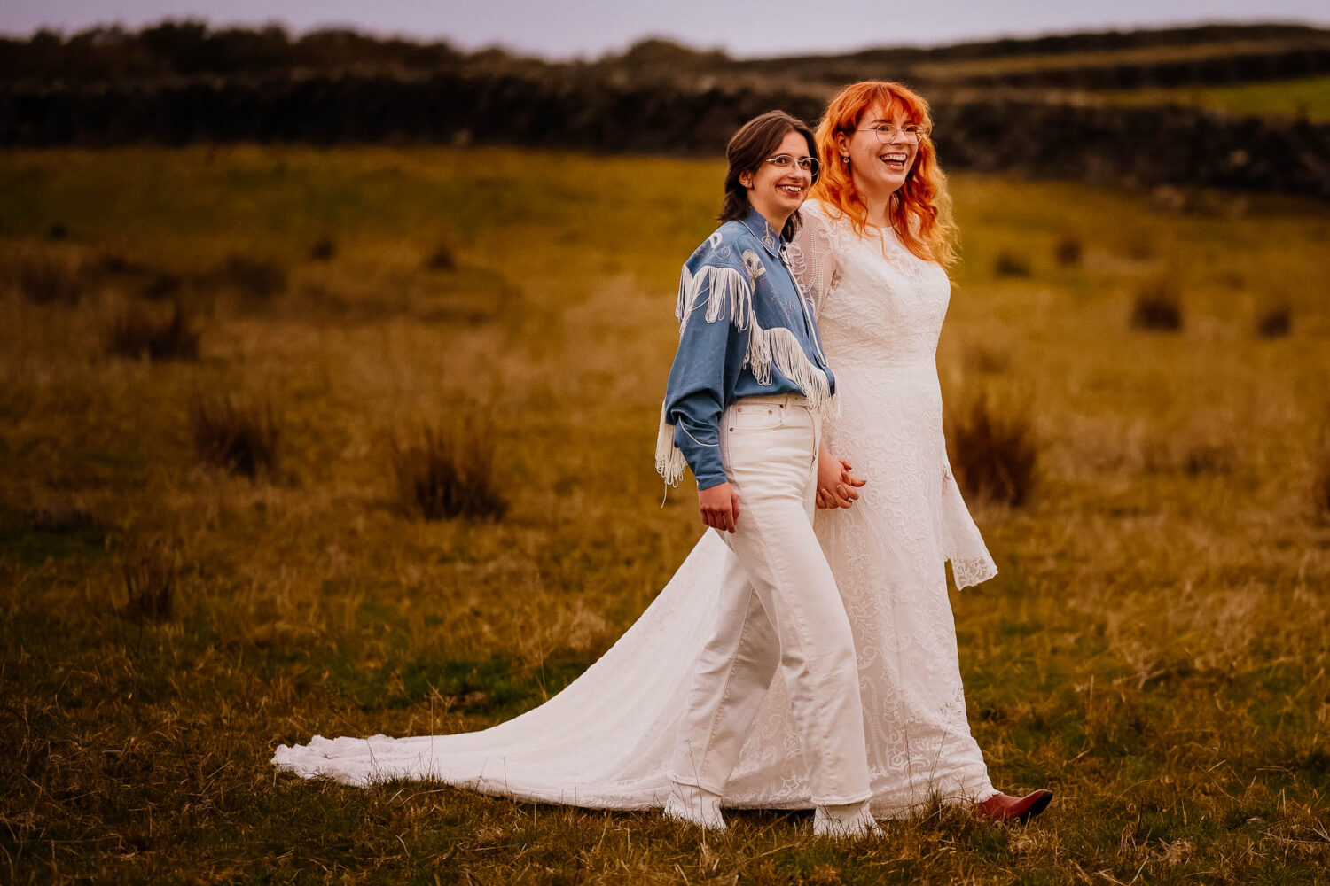 Couple walking through the fields at Chilli Barn