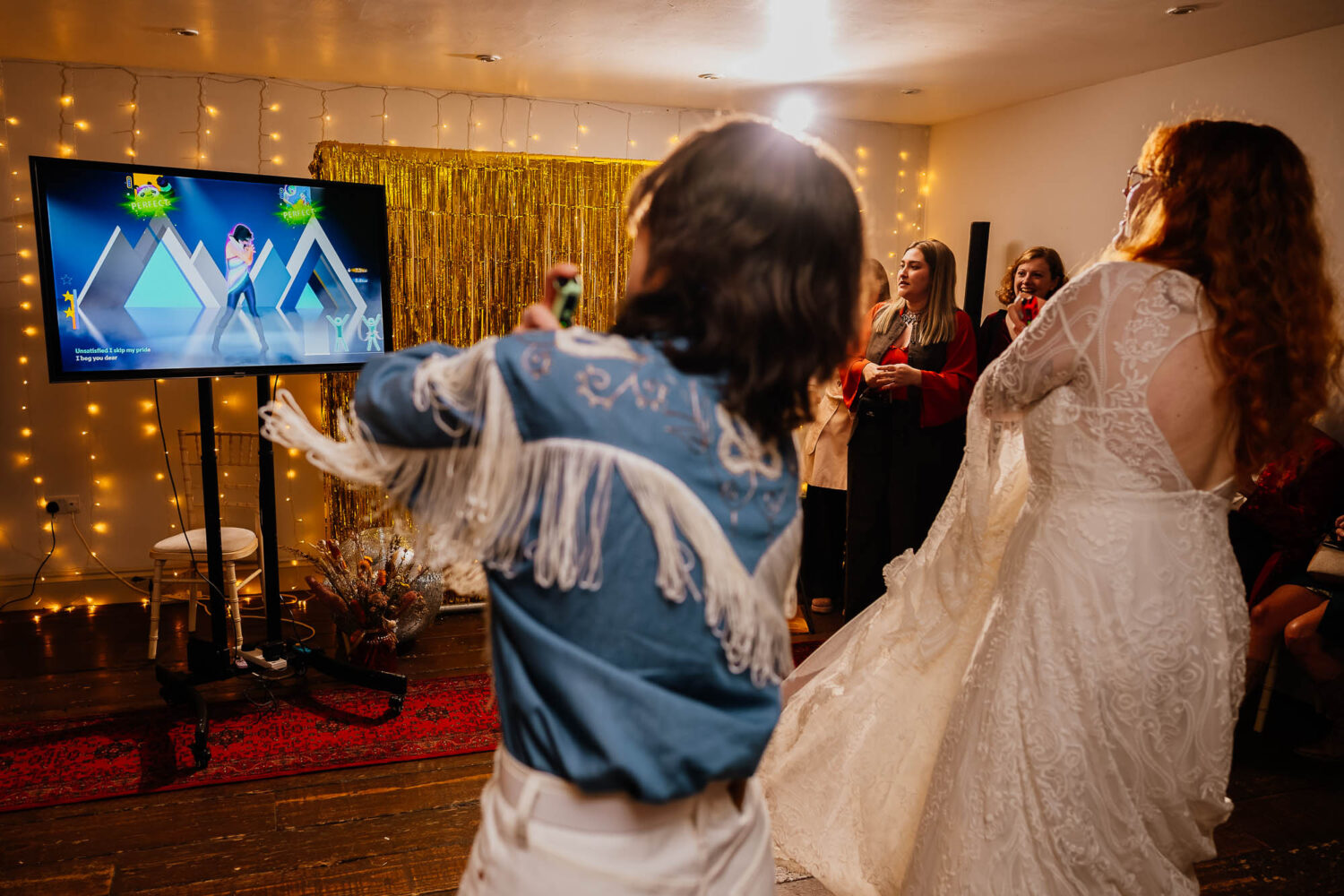 Couple copying the moves on the nintendo switch game