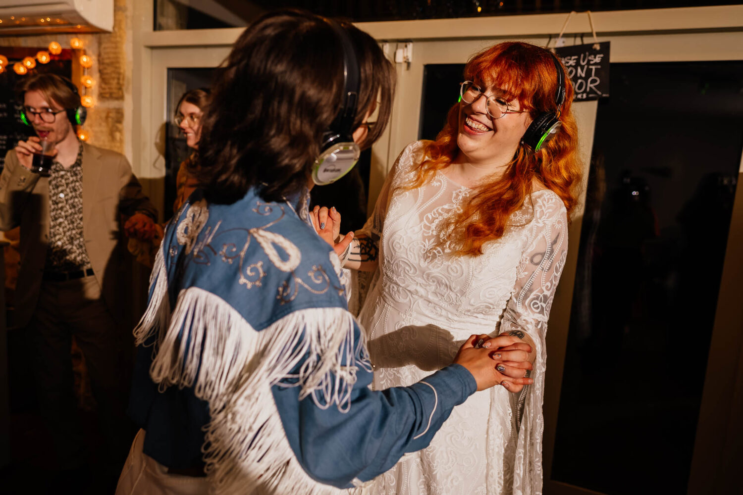 Couple dancing with headphones on