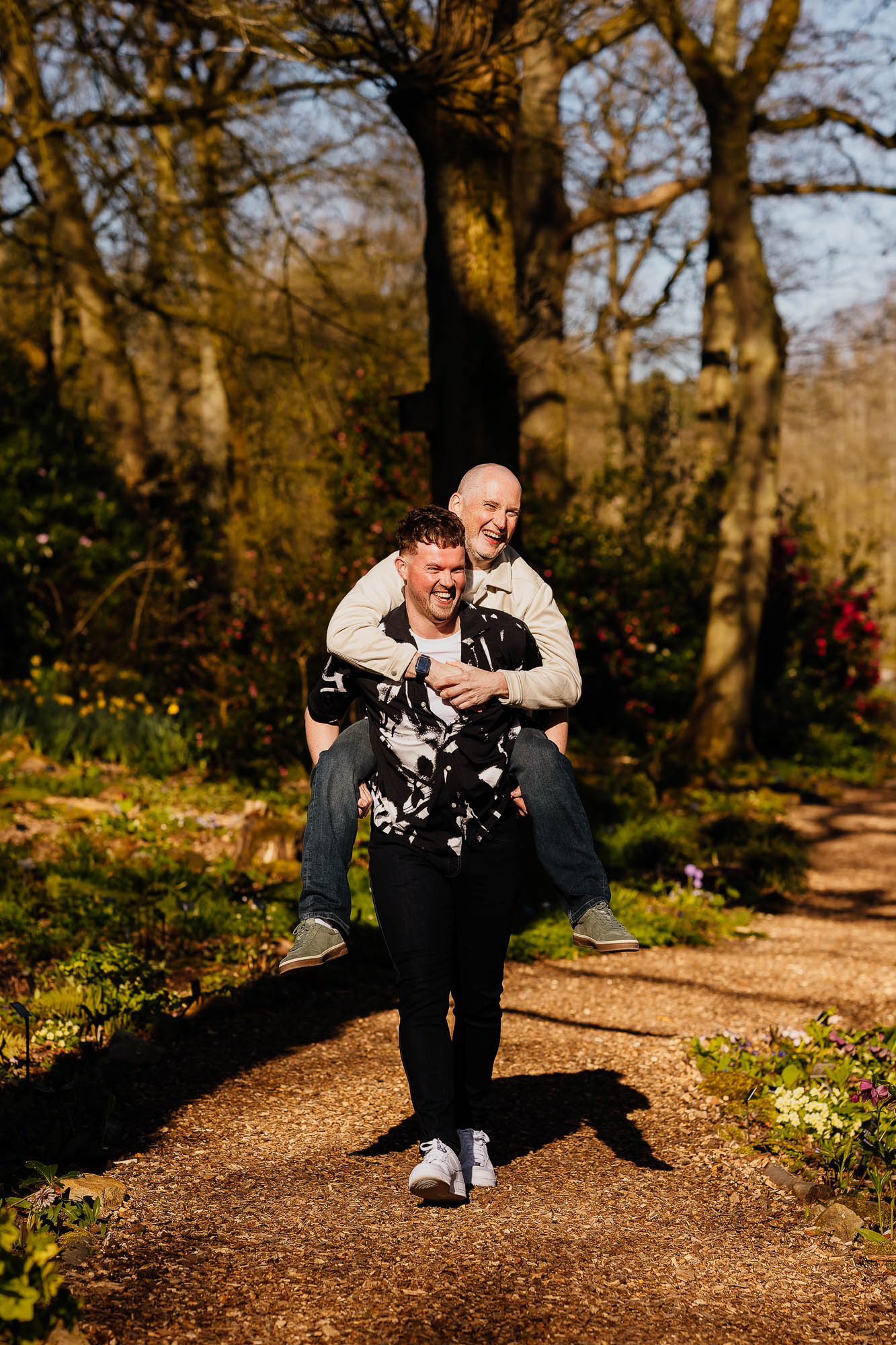 Couple piggybacking on their pre-wedding shoot