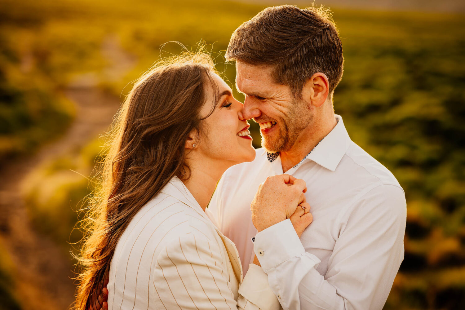 Close up of couple smiling on their pre-wedding shoot in the moors